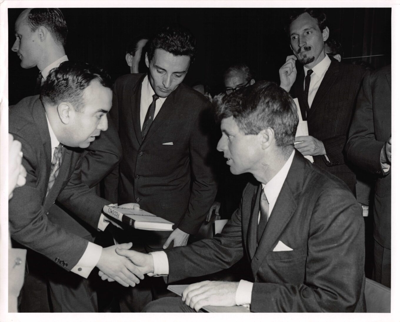 RFK signs autographs during a visit to Argentina