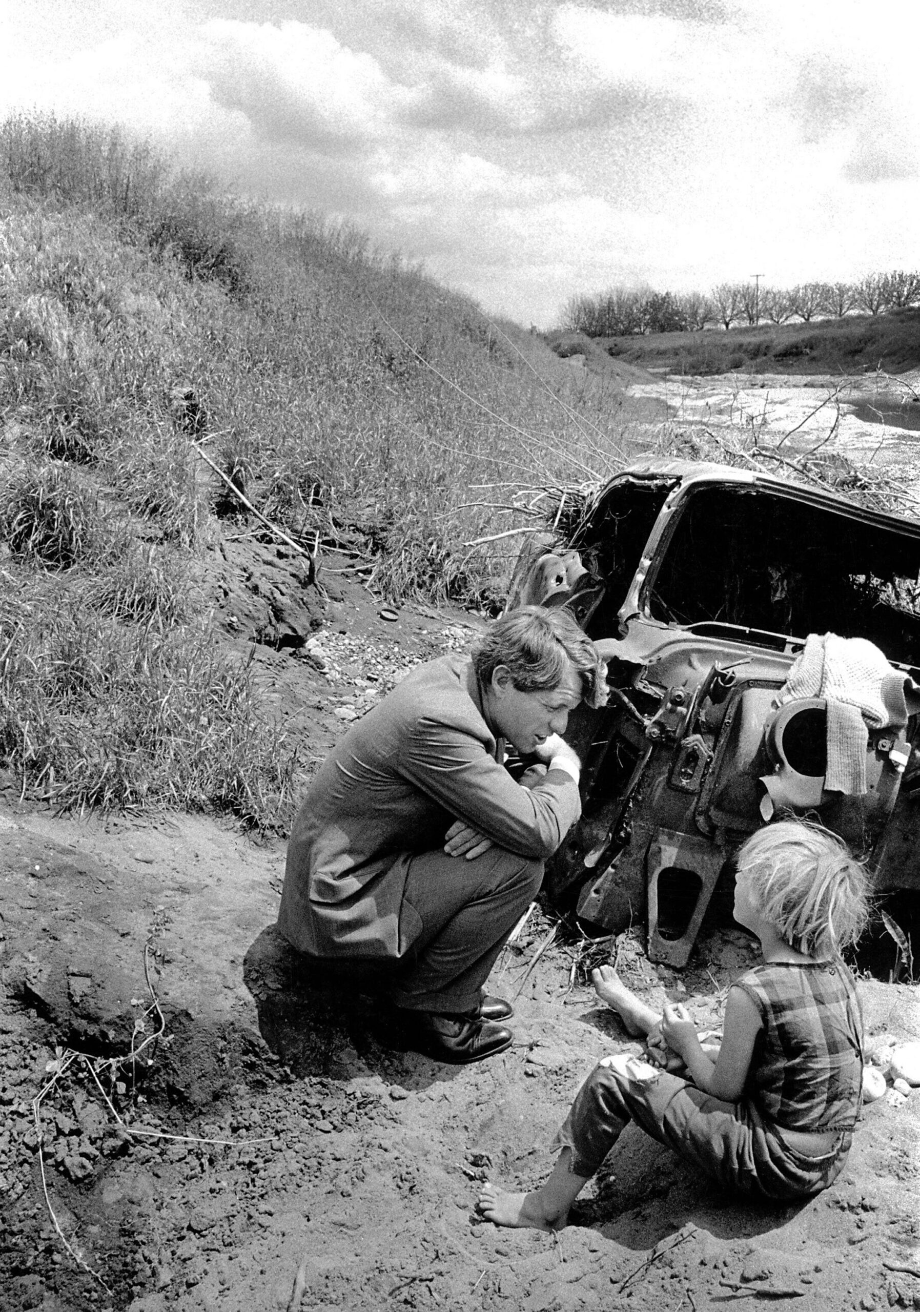 Robert F. Kennedy with a migrant child